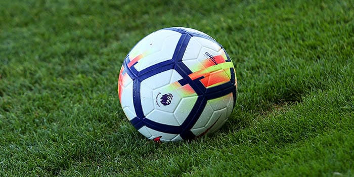 Ball with the EPL logo on a soccer field