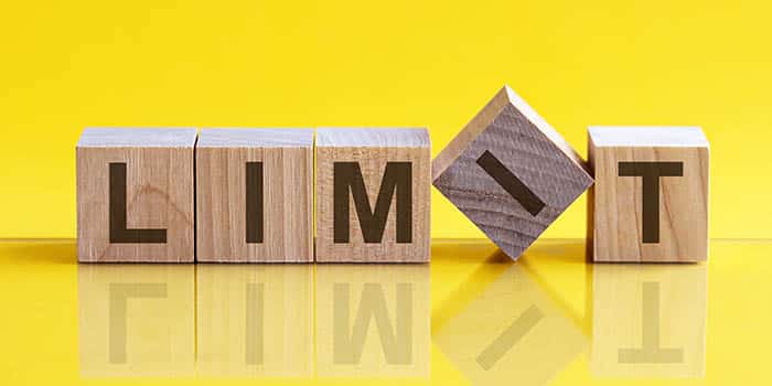 Wooden blocks spelling the word "limit"