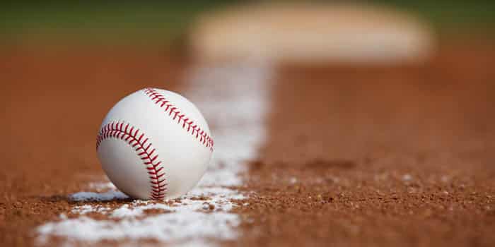 A baseball ball on the ground