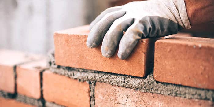 A builder works on a construction project