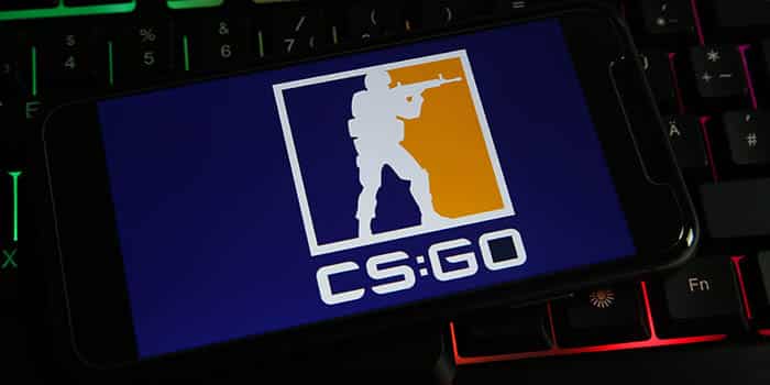 CS:GO's official logo appears on a mobile device