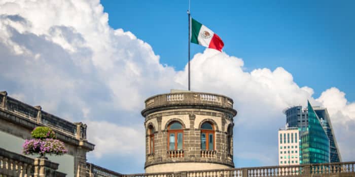 A Mexican flag on a pole at Chapultepec castle in Mexico City