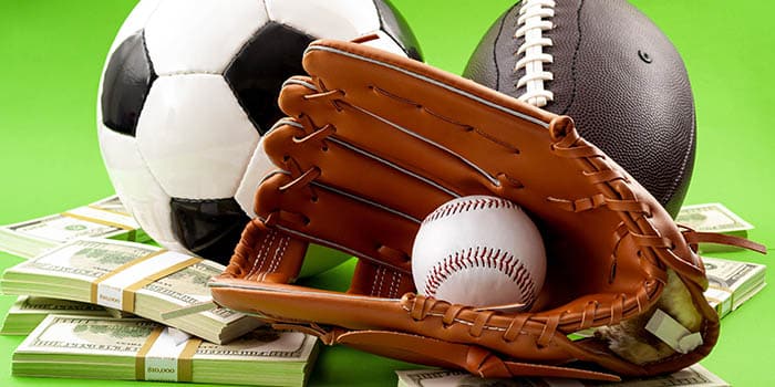 Sports equipment on top of a pile of cash