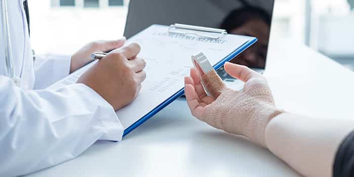 A person with injured finger visits the doctor