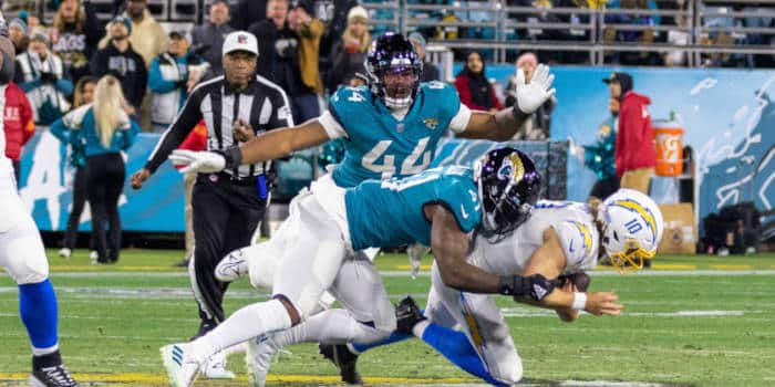 A Jags player tackling another player.