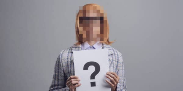 anonimity-woman-holding-a-question-mark
