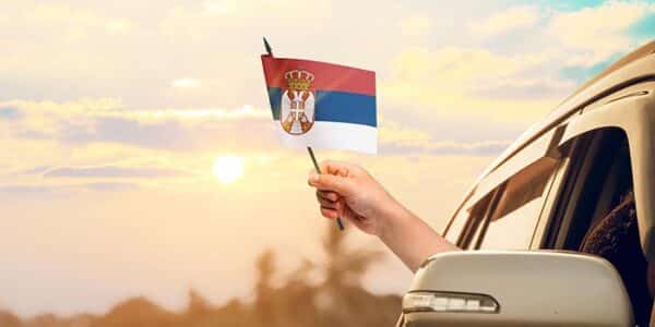 person-waving-serbian-flag-from-car-serbia-news