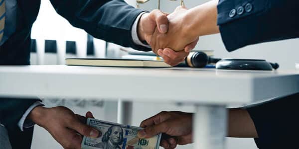 money-under-table-bribe-news