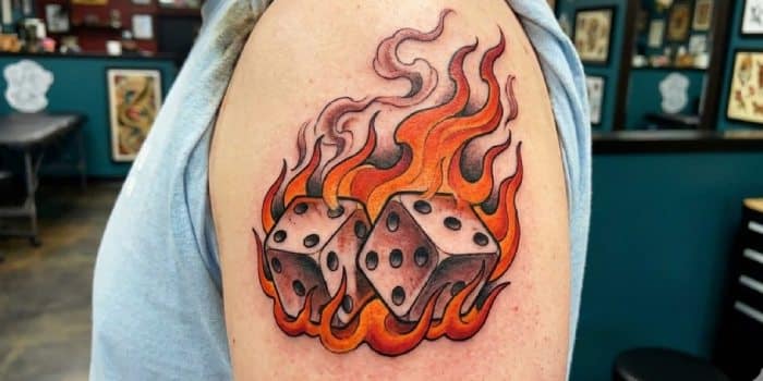 flaming dice gambling tattoo
