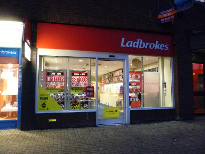 Ladbrokes betting shop at night.